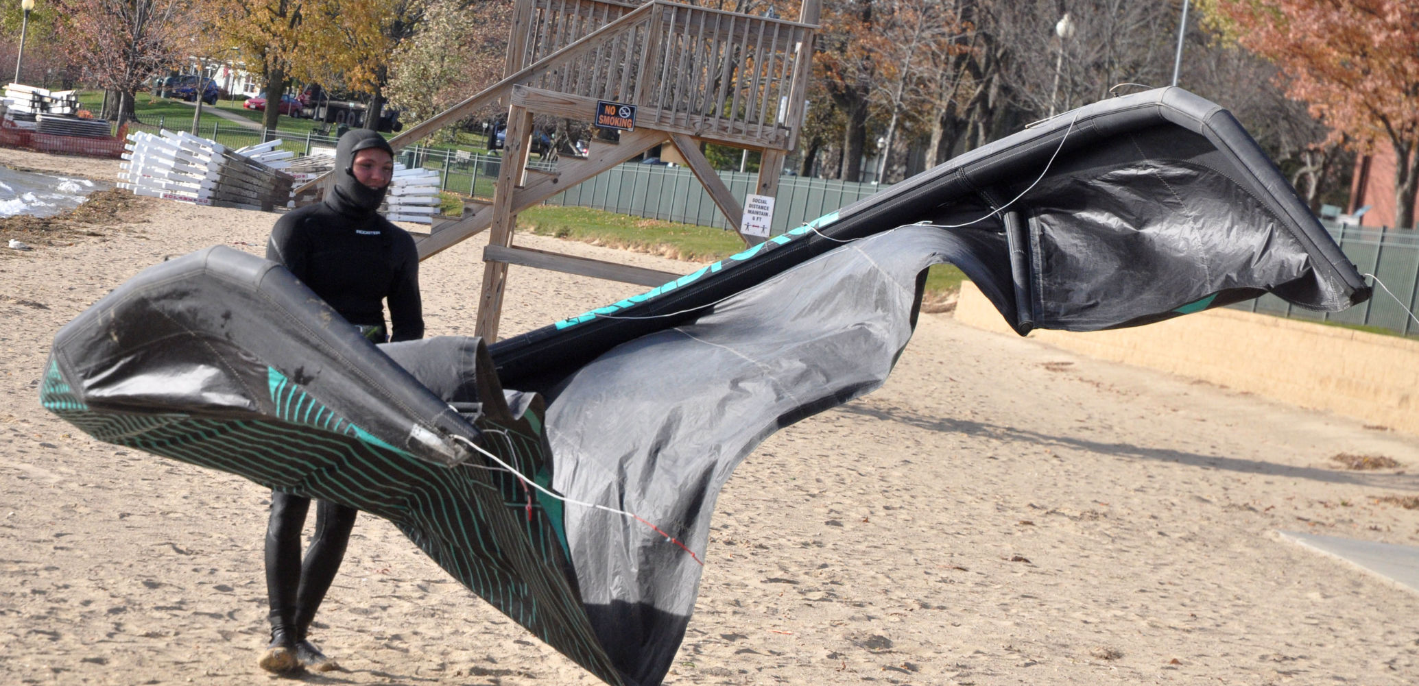 Harry Melges pulls his kite into Geneva Lake as he prepares to do some kite boarding
